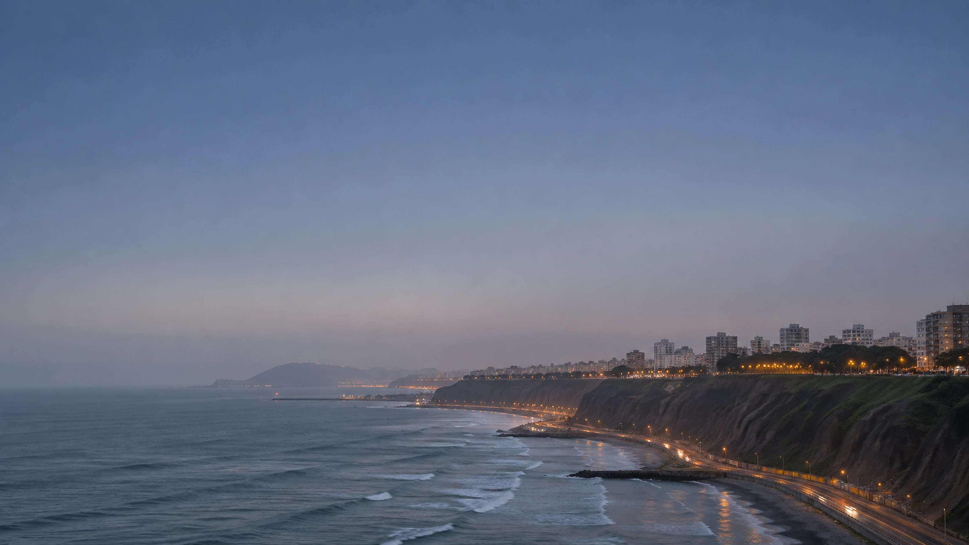 The Costa Verde cliffs of Miraflores, Lima, at dusk.